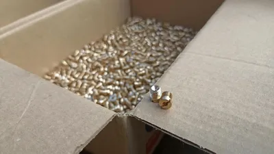 Brass parts in a shipping box